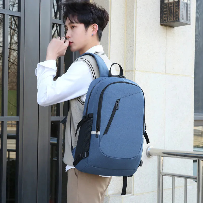Grey Oxford cloth computer backpack with front pocket and adjustable straps, shown with laptop compartment open.