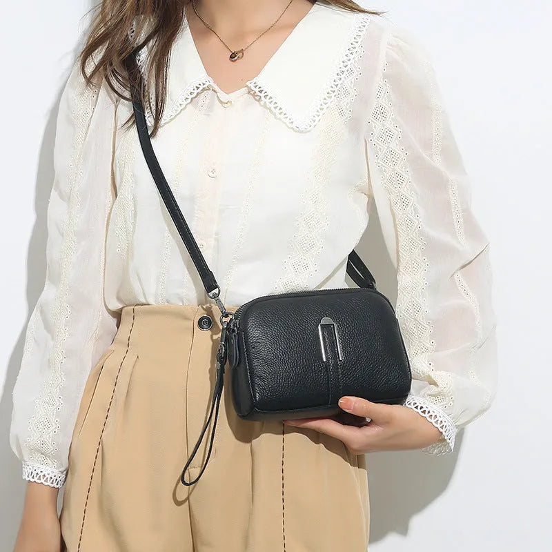 Genuine cowhide leather women's shoulder bag with horizontal square shape in dark green colour.