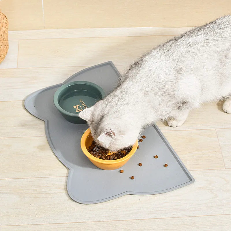 Cat head shaped silicone pet feeding mat in blue colour measuring 44x24cm