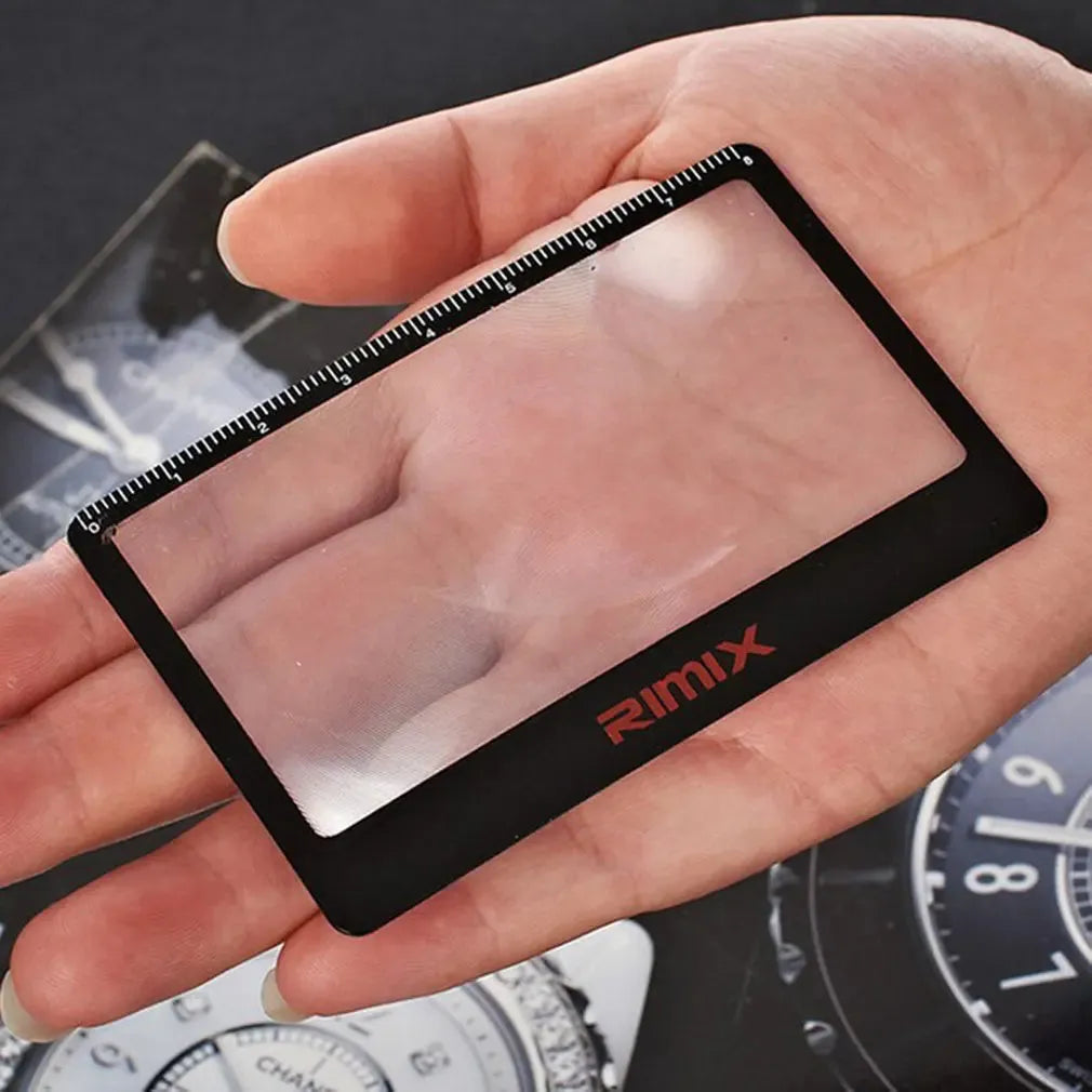 Black and white portable credit card sized plastic magnifier for reading