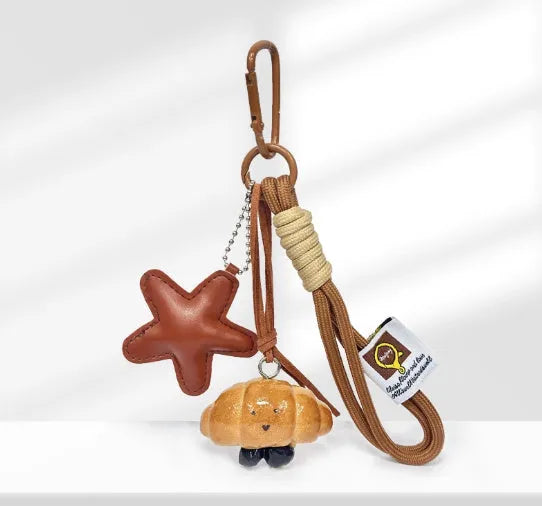 Handmade soda bread design handbag pendant with brown star carrying strap and baking varnish finish