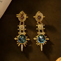 Gold geometric court style stud earrings with retro design and round elements