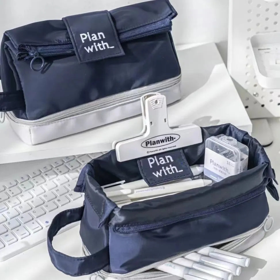 Dark blue foldable double layer student pencil case made from polyester fabric.