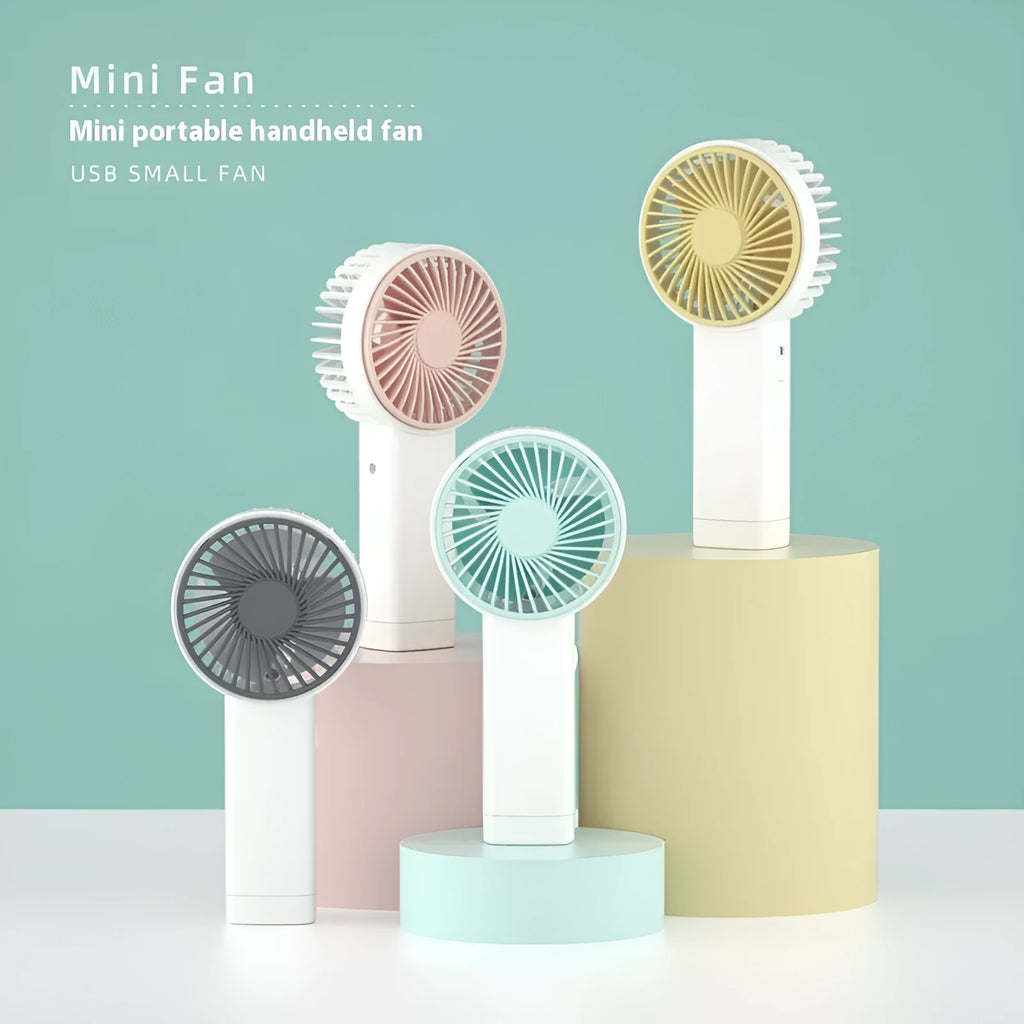 Outdoor portable USB rechargeable handheld fan with three plastic blades, available in multiple colours and cartoon designs