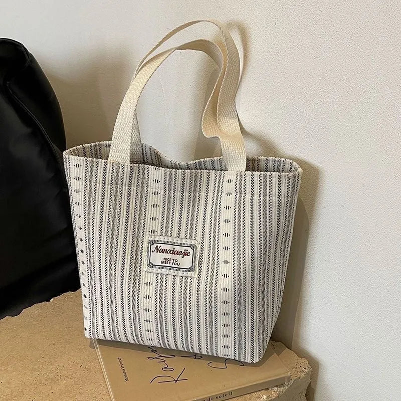 Japanese style corduroy shoulder tote handbag in dark brown colour showing textured fabric and large capacity design