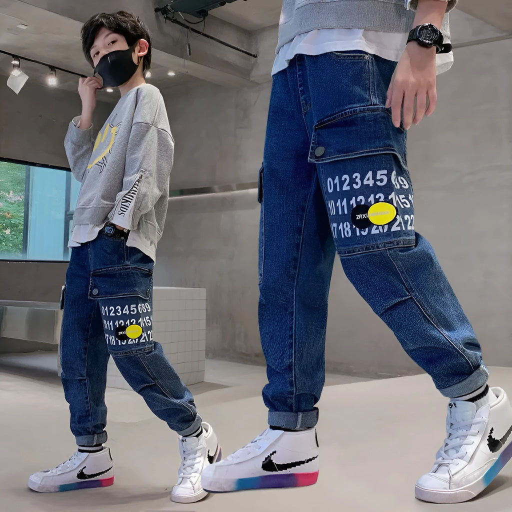 Boys printed blue cotton mid-waist girdled jeans with rubber band belt on white background