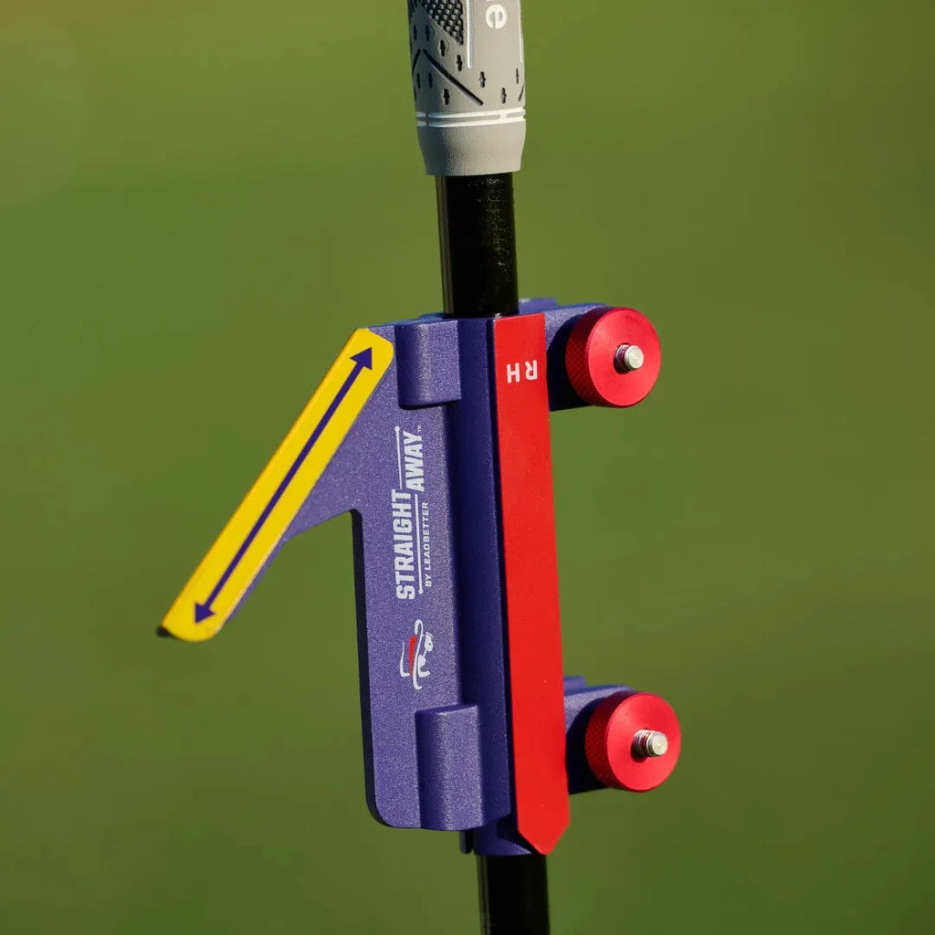 Plastic golf swing plane trainer simulator on a plain background.