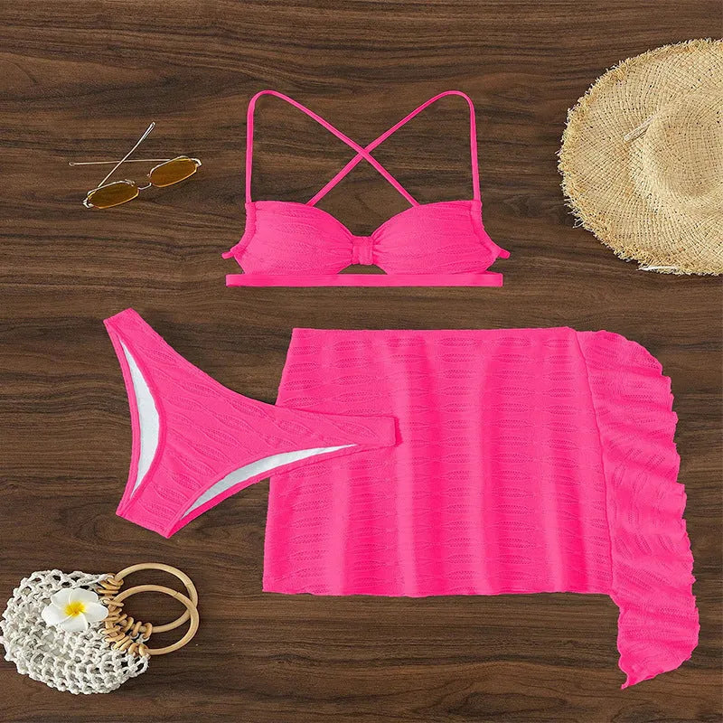 Women's light pink lace-up bikini three-piece set with matching skirt on mannequin