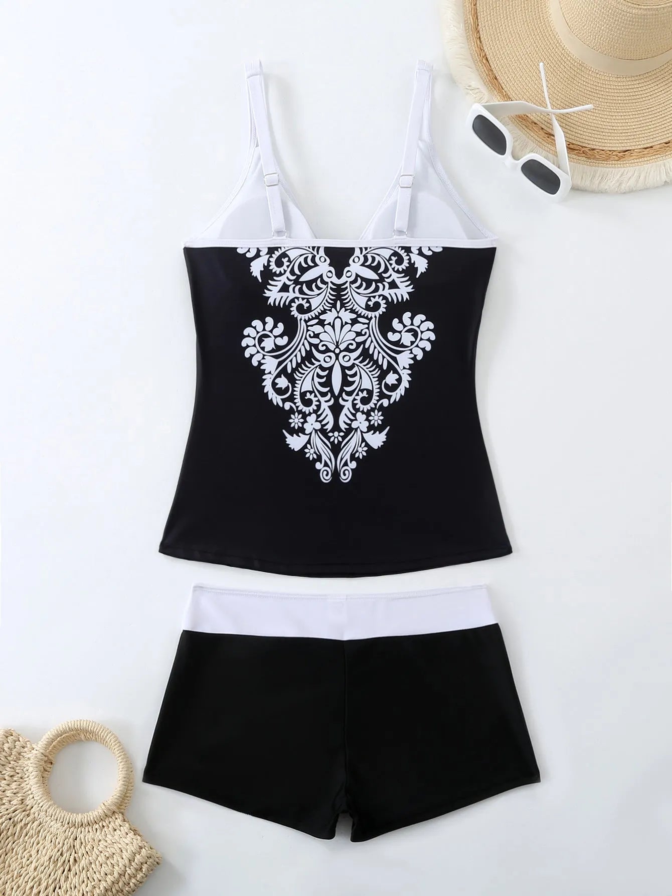 Plus size women's two-piece printed swimsuit in black or rose red with a cotton lining.