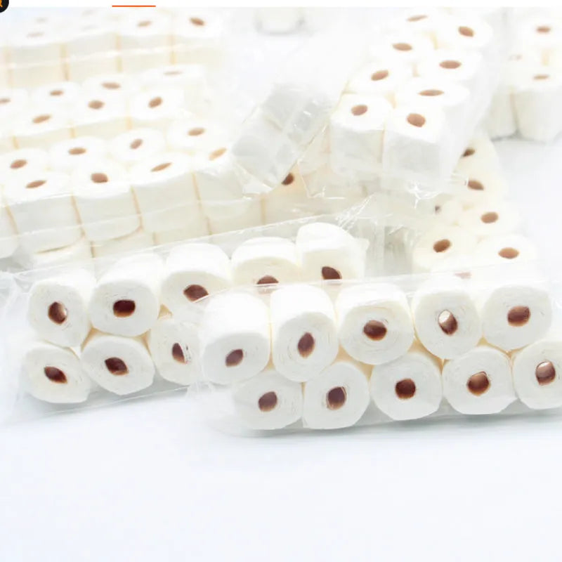 Small paper model of a tissue roll on a core, measuring 30mm by 15mm by 80mm.