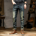 Men's slim-fit jeans in a retro colour with a zip fly, shown laid flat.