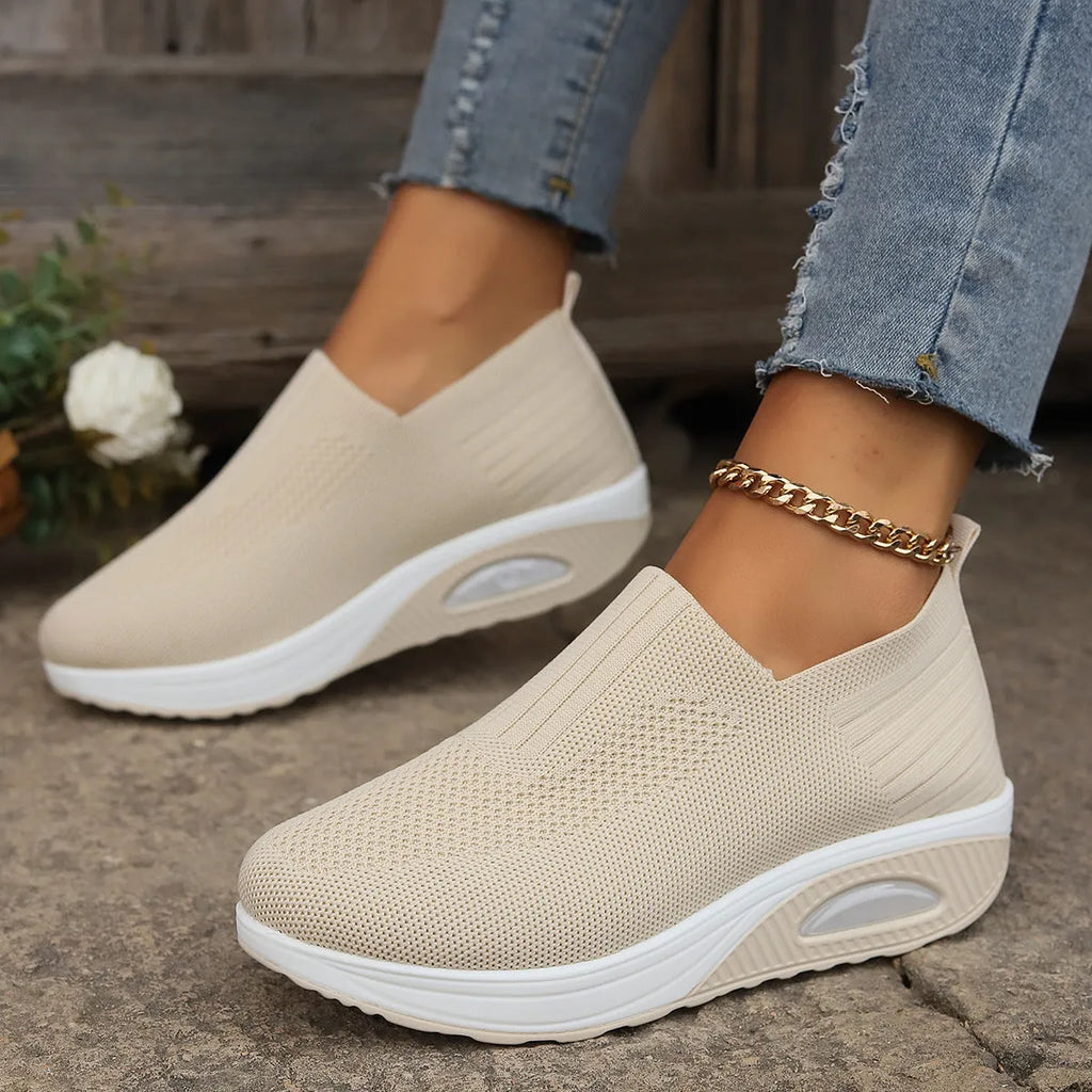 Slip-on casual women's shoes in beige with knitted upper, low top wedge heel, and round toe