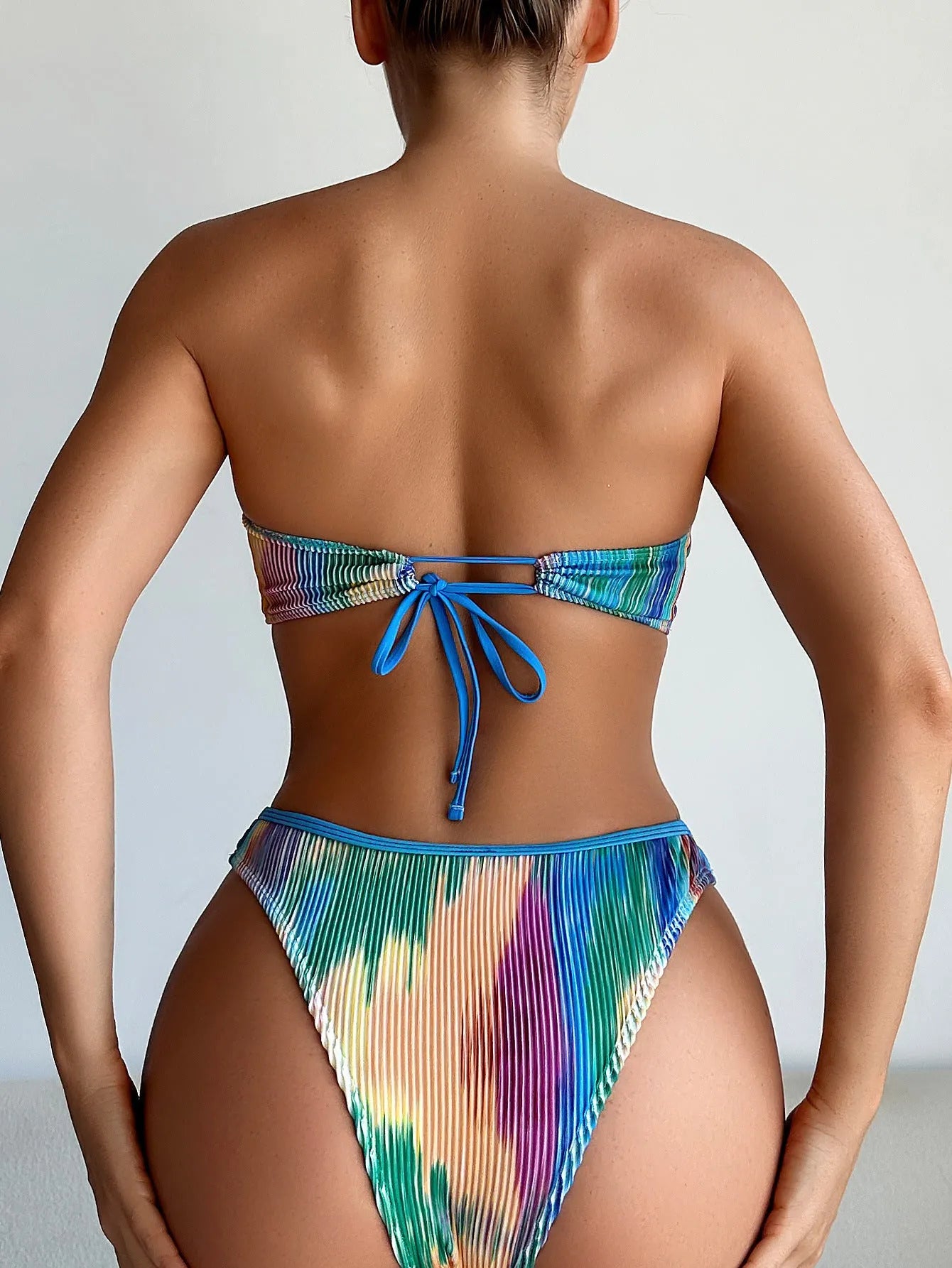 Women's colour printed tube top and briefs bikini set made from polyester fabric.