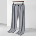 Men's black ice silk straight loose trousers with elastic waistband on hanger