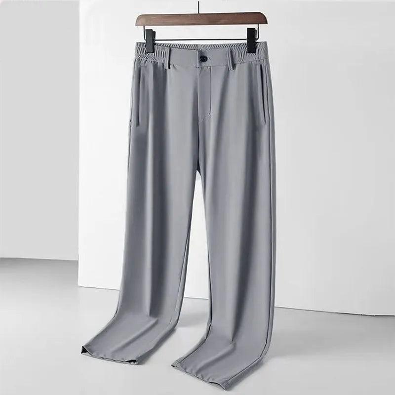 Men's black ice silk straight loose trousers with elastic waistband on hanger