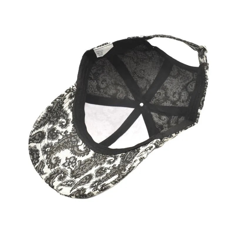 Blue polyester baseball cap with printed paisley pattern showing dome crown design