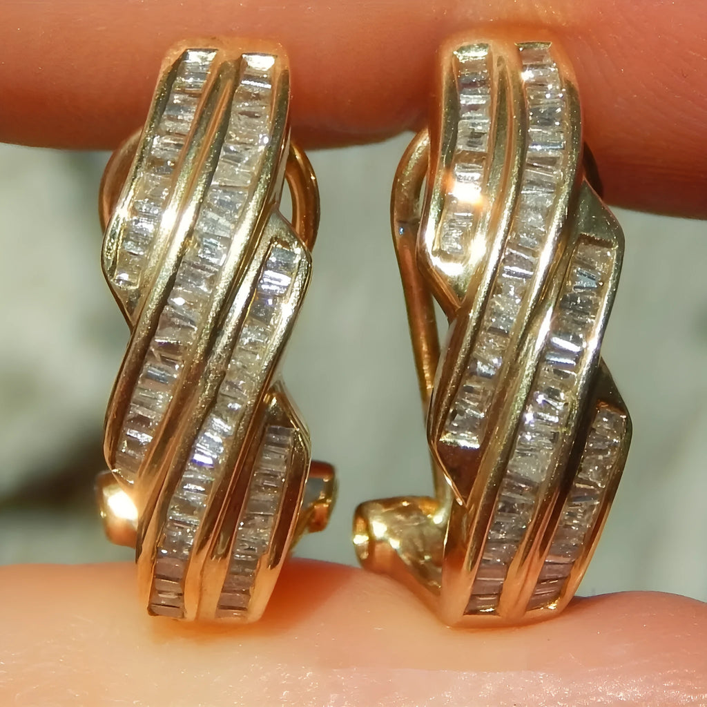 A pair of gold-coloured geometric copper earrings with round design details.