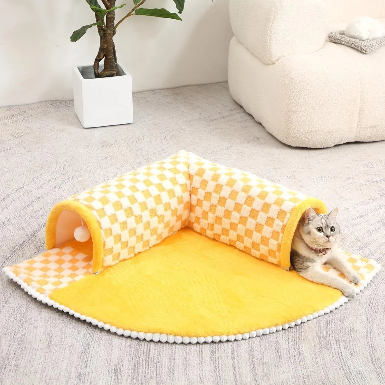 Coffee coloured plush fan-shaped pet bed with attached tunnel, showing anti-slip base.