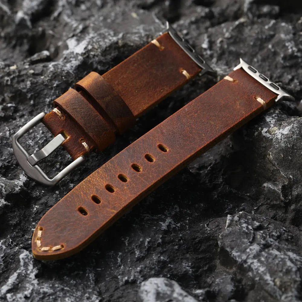 Brown handmade top layer cowhide watch strap with stainless steel buckle on a watch