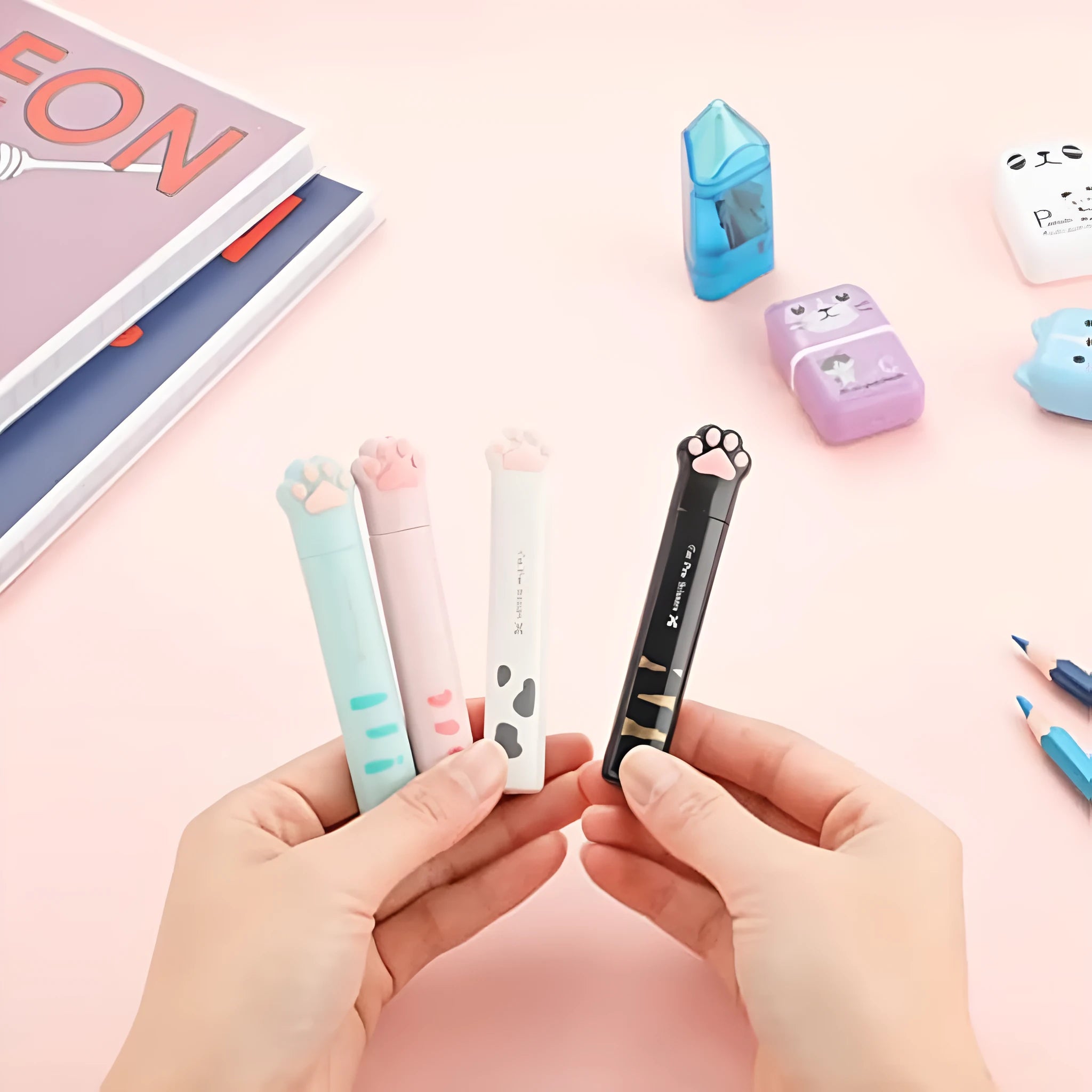 Cat paw design mini folding scissors with stainless steel blades shown open and closed