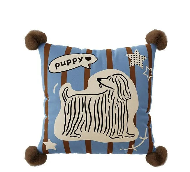 Blue cartoon anime print decorative sofa cushion pillow on a grey sofa.