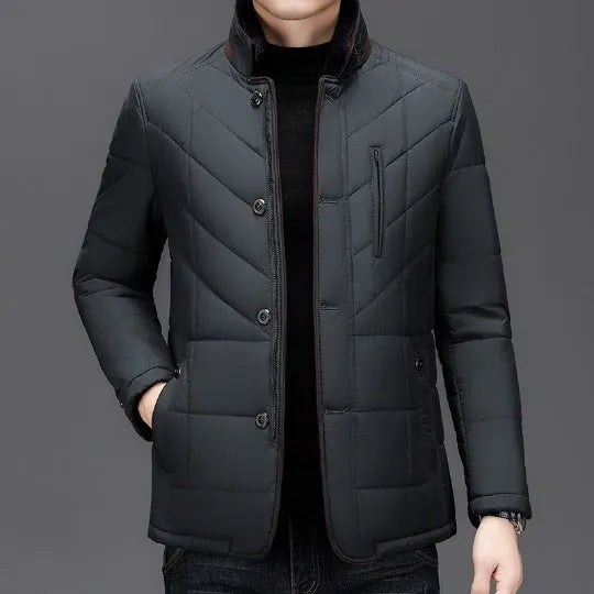 Men's dark blue winter short padded coat with side pockets on a solid background.
