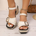 Women's black square toe sandals with a chunky heel and metal buckle on a white background.