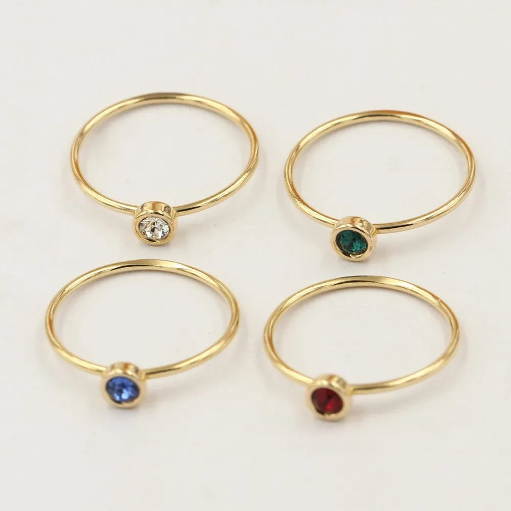 14K gilded GF zircon knuckle rings in green, blue, dark red, and white colours