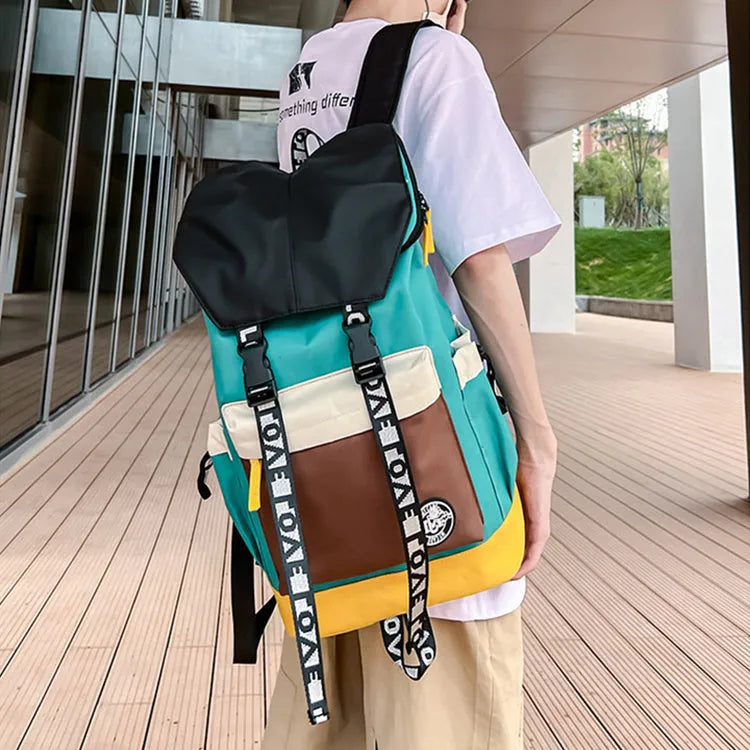 Oxford cloth school backpack in black, green, or red colour options.
