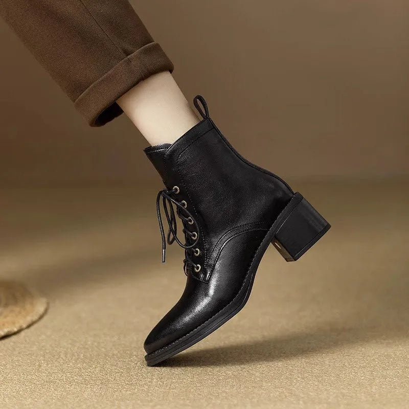 Black pointed-toe women's short tube ankle boots with a 5.5cm heel on a white background.