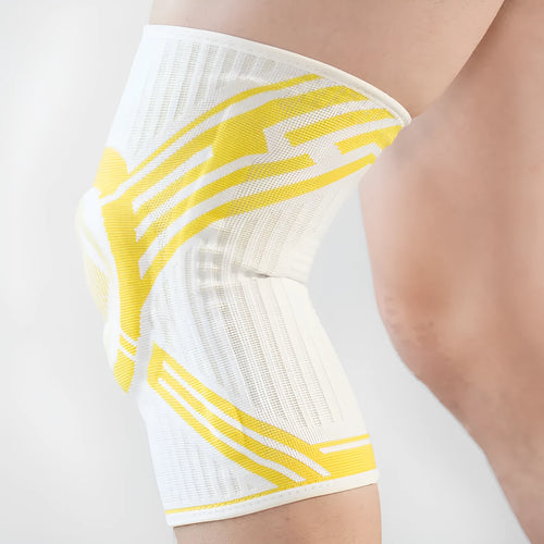 A blue elastic cotton knee pad for adult sports protection, shown alongside grey and yellow colour options.
