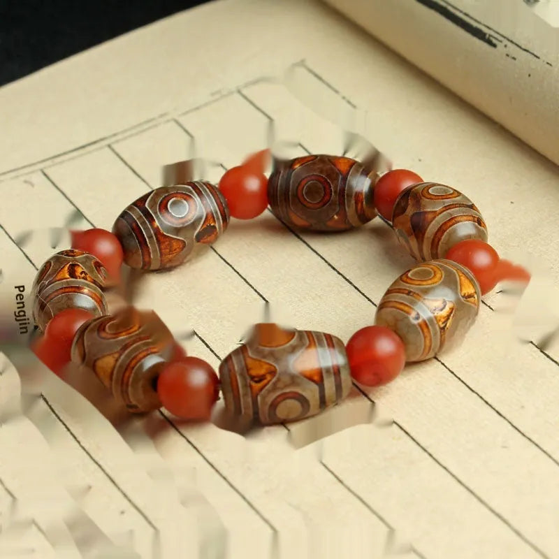 Distressed agate Tibet beads bracelet with three eye dzi design and polished stone beads