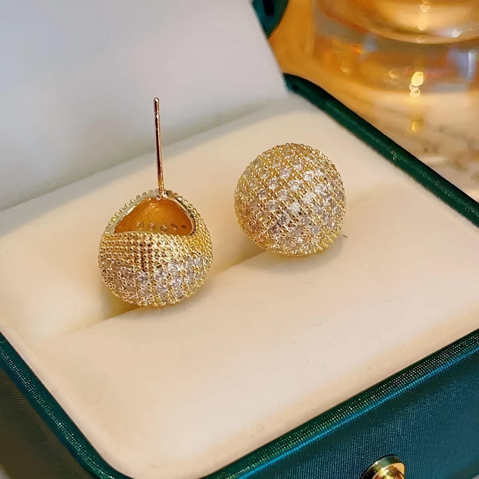 Geometric drop-shaped golden beans and diamond ear clips in gold and white colour options