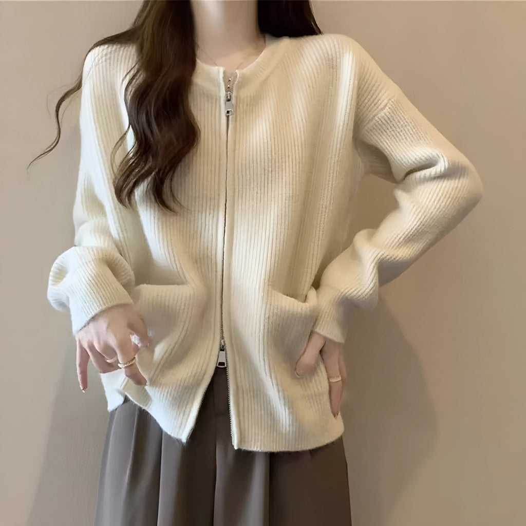 Beige soft viscose long sleeve sweater coat cardigan on a hanger.