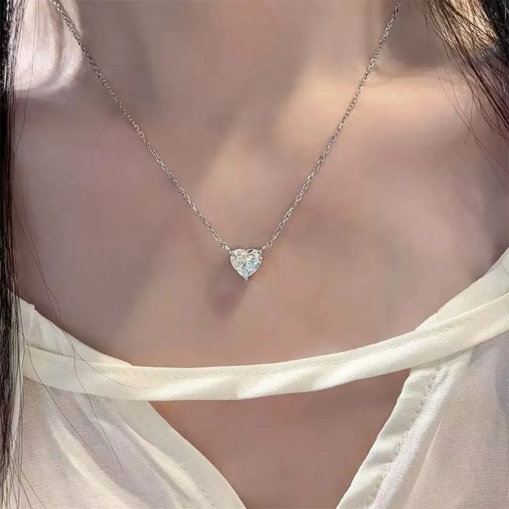 Women's silver heart-shaped love necklace on copper chain with simple refined design