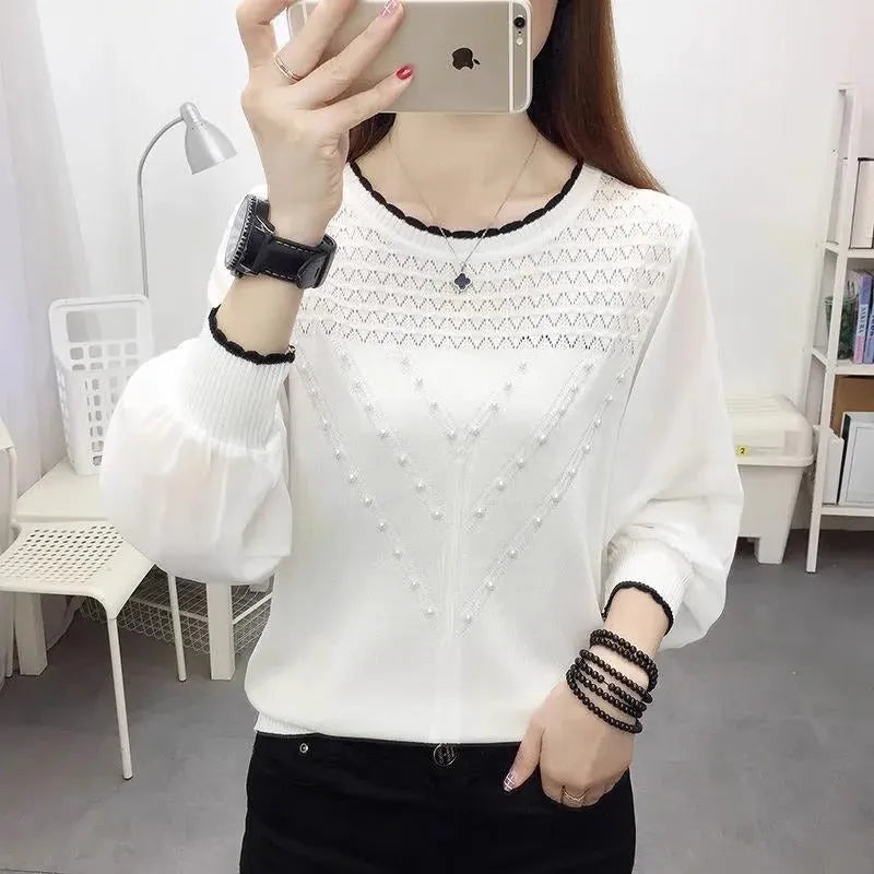 Loose-fit long sleeve round neck women's polyester top in solid colour, available in black, pink, and white.