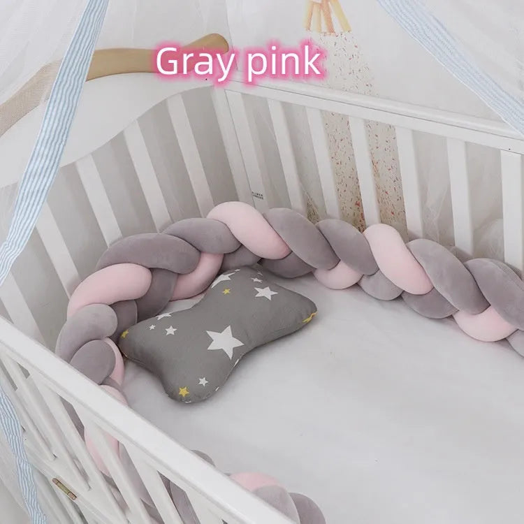 Braided knot style baby cot bumper in spandex crystal velvet fabric, shown in a light grey colour.