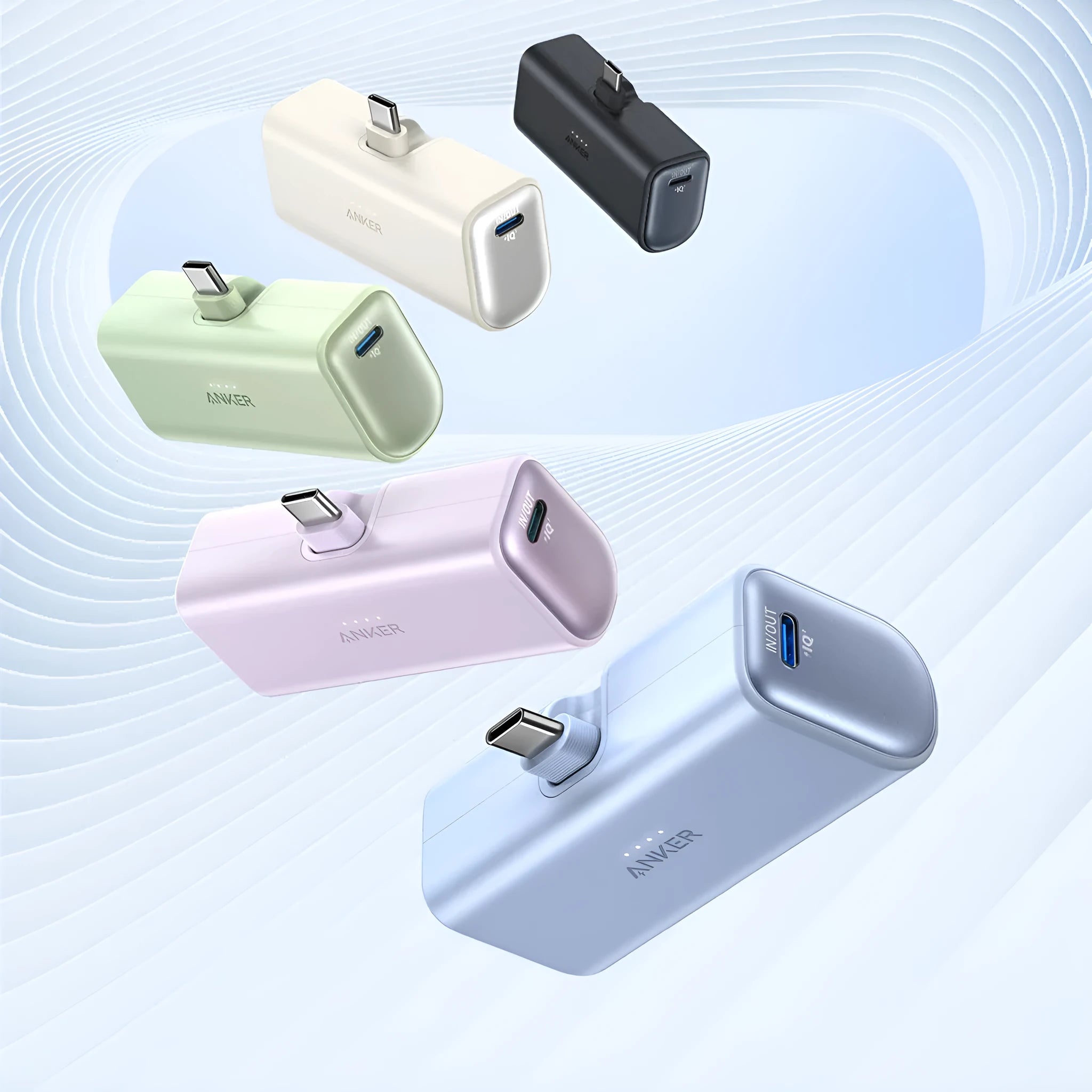 Small capsule-shaped power bank in various colours showing its foldable USB-C connector.