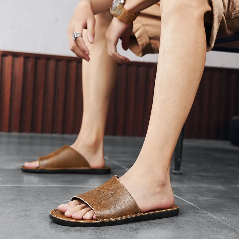 Brown leather men's casual sandals with a rubber sole on a white background.