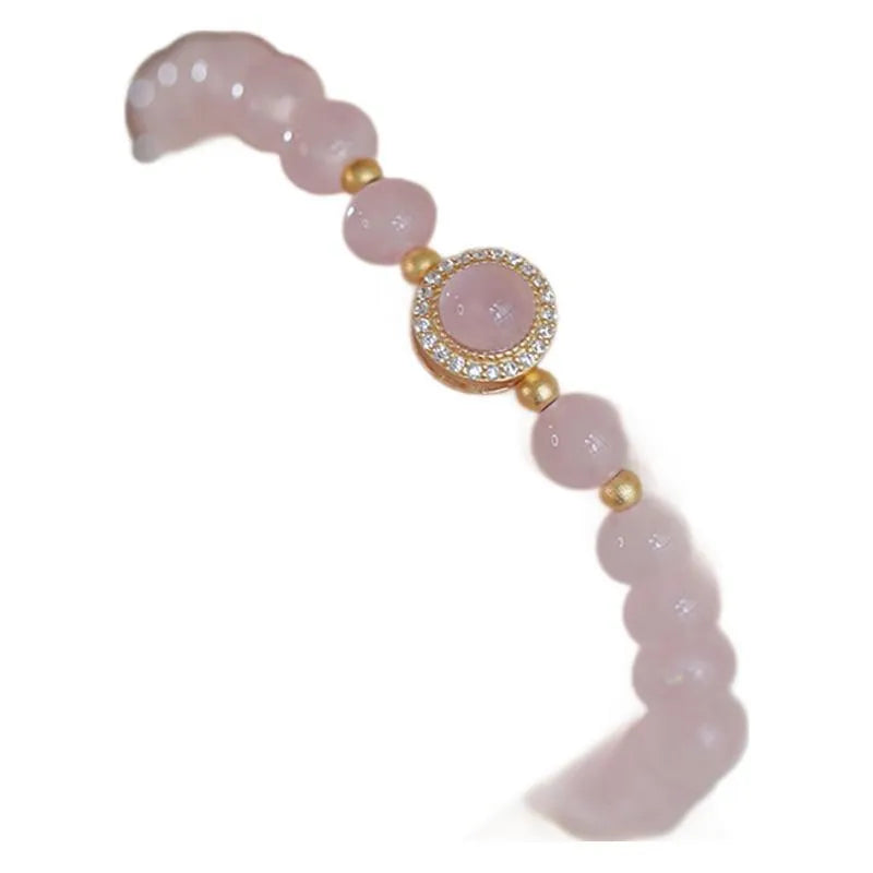 Women's copper bracelet with pink crystal pearls and golden balls, natural style jewellery.