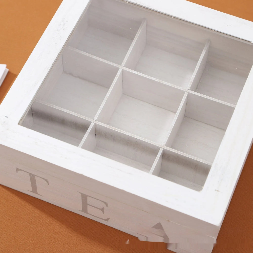 White wooden multi-grid coffee storage box with transparent cover on a desk