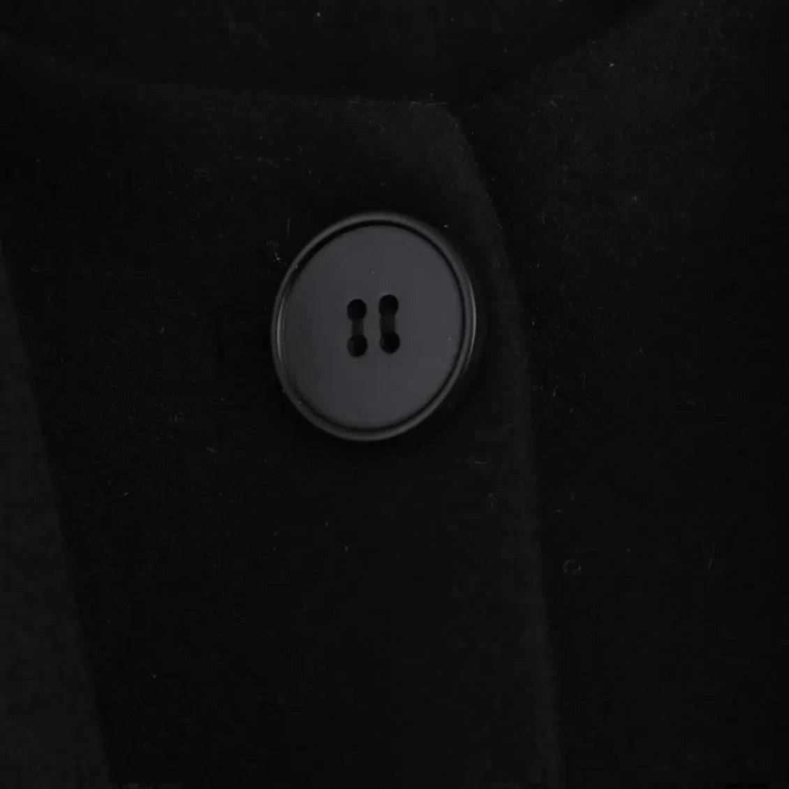 Women's long black polyester overcoat with a grey artificial fur collar, shown at full length.