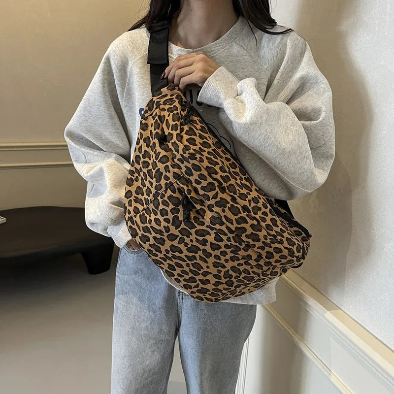 Retro leopard print canvas chest bag with patchwork, soft body, and internal phone pocket for daily matching.