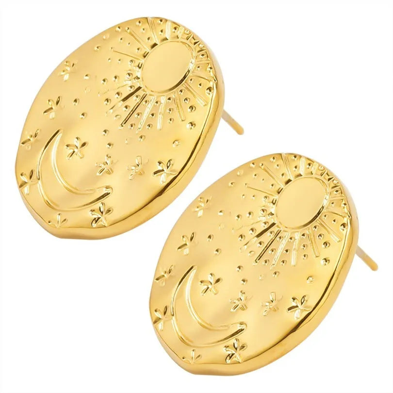 A pair of geometric shell design stud earrings in stainless steel with a gold electroplated finish.