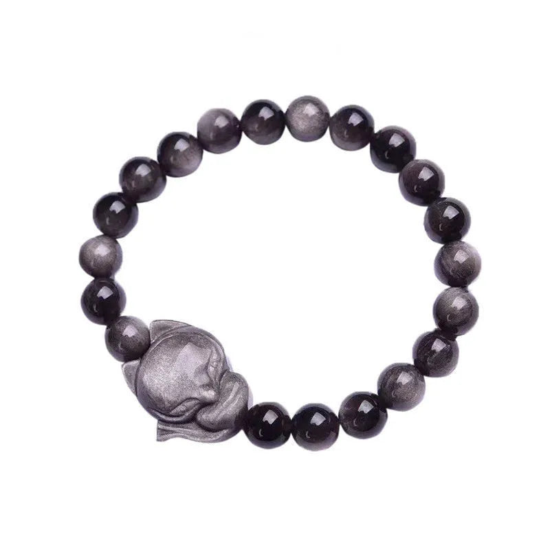 Women's obsidian bracelet with a single 8mm polished bead and a silver fox charm on an adjustable leather cord.