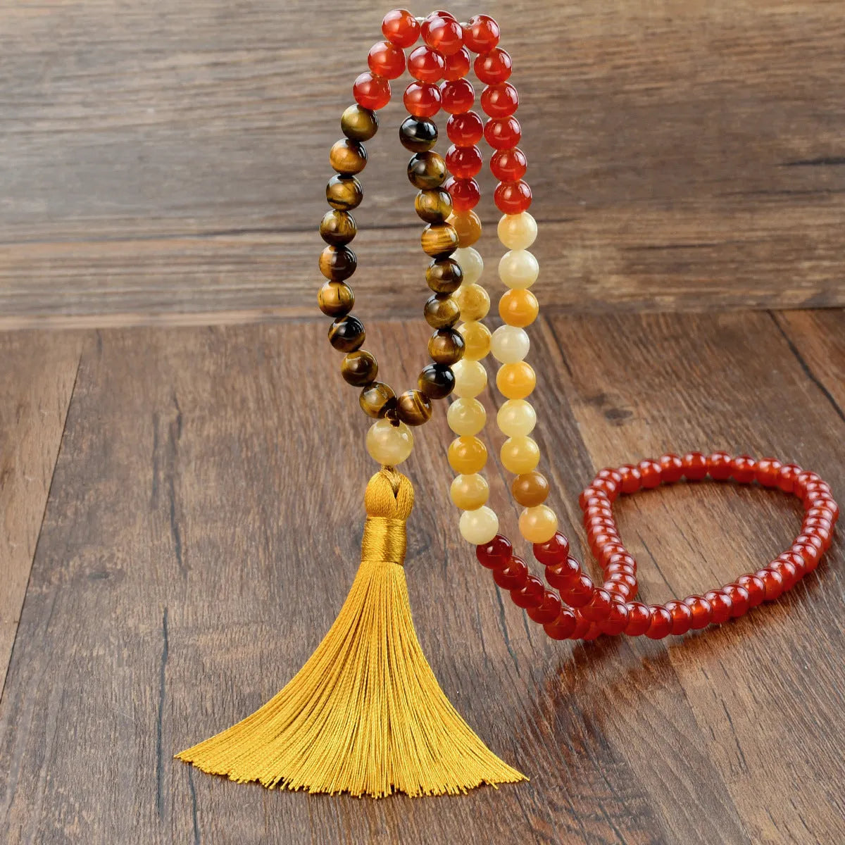 Long beaded bohemian necklace with 108 natural stones, a geometric pendant, and colourful tassels on an 81cm chain.