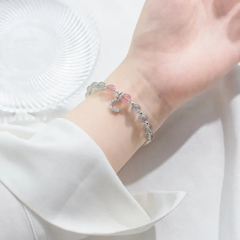 Natural moonstone handmade bracelet with crescent moon and crystal charms on adjustable chain