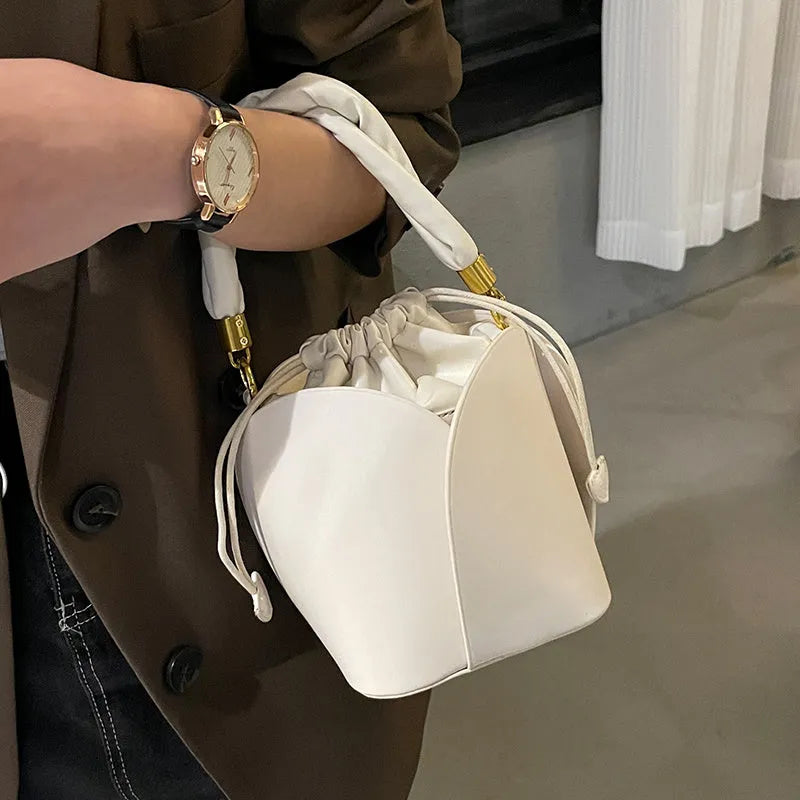 Women's small PU retro bucket bag in apricot with single shoulder strap and soft handle
