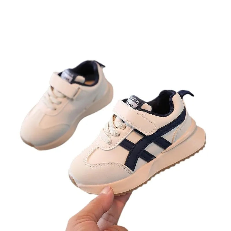 Children's white synthetic leather sneakers with Velcro fastening and rubber non-slip soles