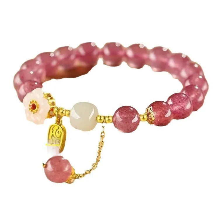 Handcrafted strawberry quartz crystal bracelet with Hetian jade peach blossom charms